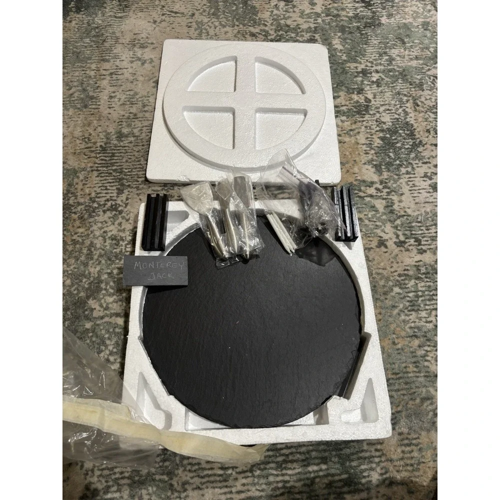 Large Slate Charcuterie Board On A Lazy Susan With Serving Utensils And Placards